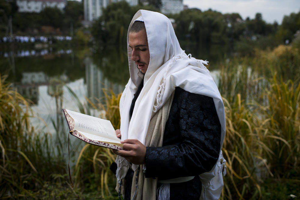 A pilgrim performs Tashlikh near a lake during the Rosh Hashanah pilgrimage to Rabbi Nachman's tomb in Uman on Monday.