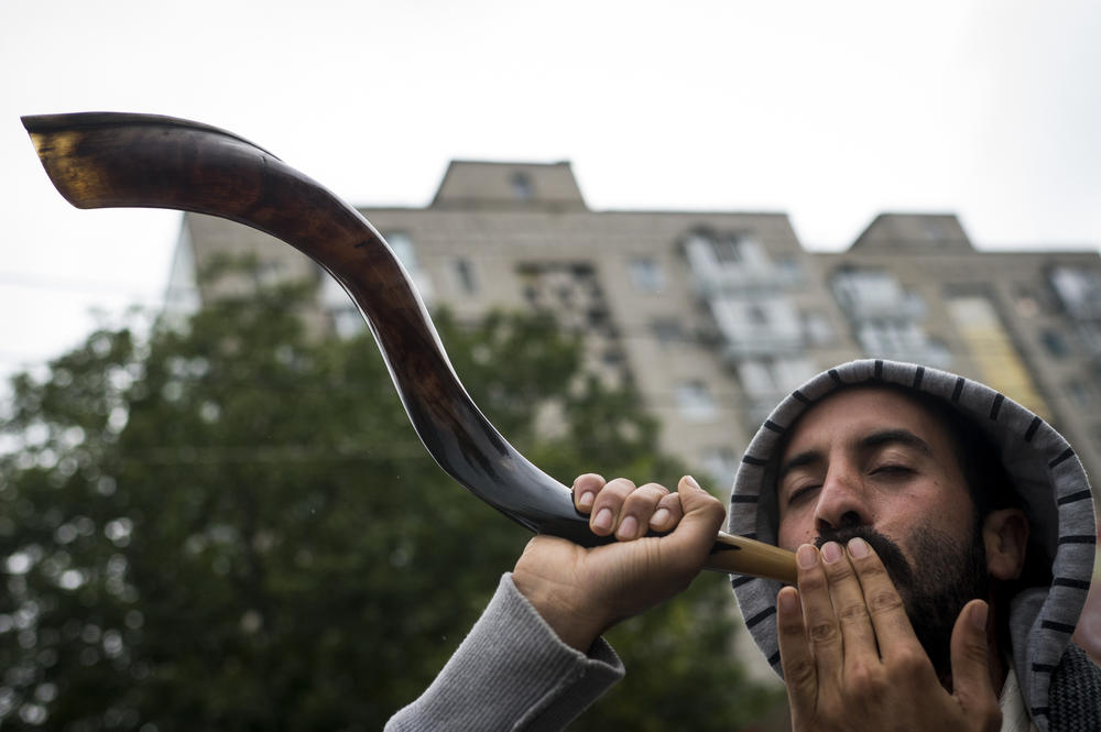 Johnny Hishgozim of Israel blows a shofar during the annual Rosh Hashanah pilgrimage to Rabbi Nachman's tomb in Uman on Tuesday.