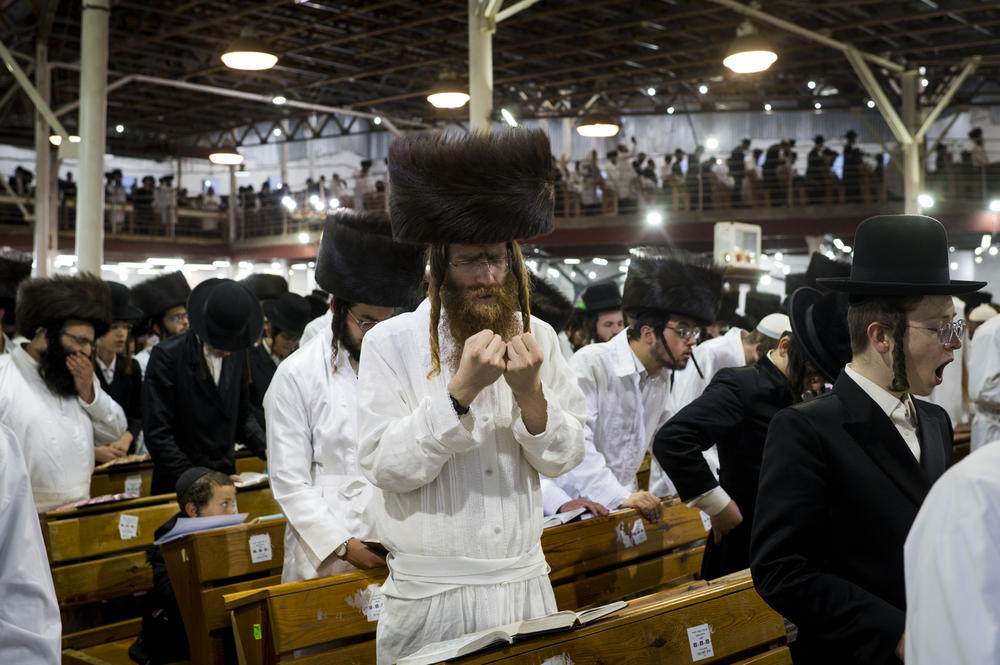 Worshipers pray in a synagogue during Rosh Hashanah. Most of the pilgrims visiting Uman are male.
