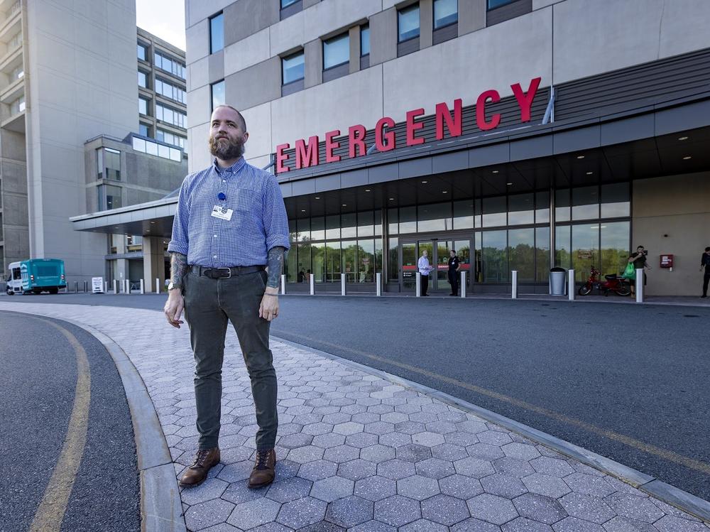 David Cave, a recovery coach who is part of an addiction specialty team at Salem Hospital, north of Boston, stands outside the emergency department.