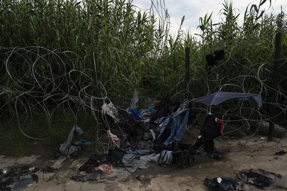 Discarded clothing left behind by migrants on the banks of the Rio Grande near Eagle Pass, Texas.