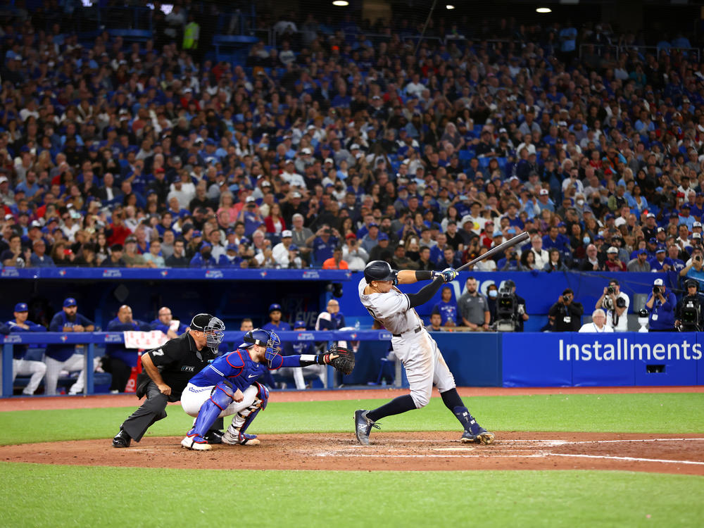 Aaron Judge of the New York Yankees hits his 61st home run of the season in the seventh inning against the Toronto Blue Jays at Rogers Centre on Sept. 28 in Toronto, Ontario, Canada. Judge has now tied Roger Maris for the American League record.