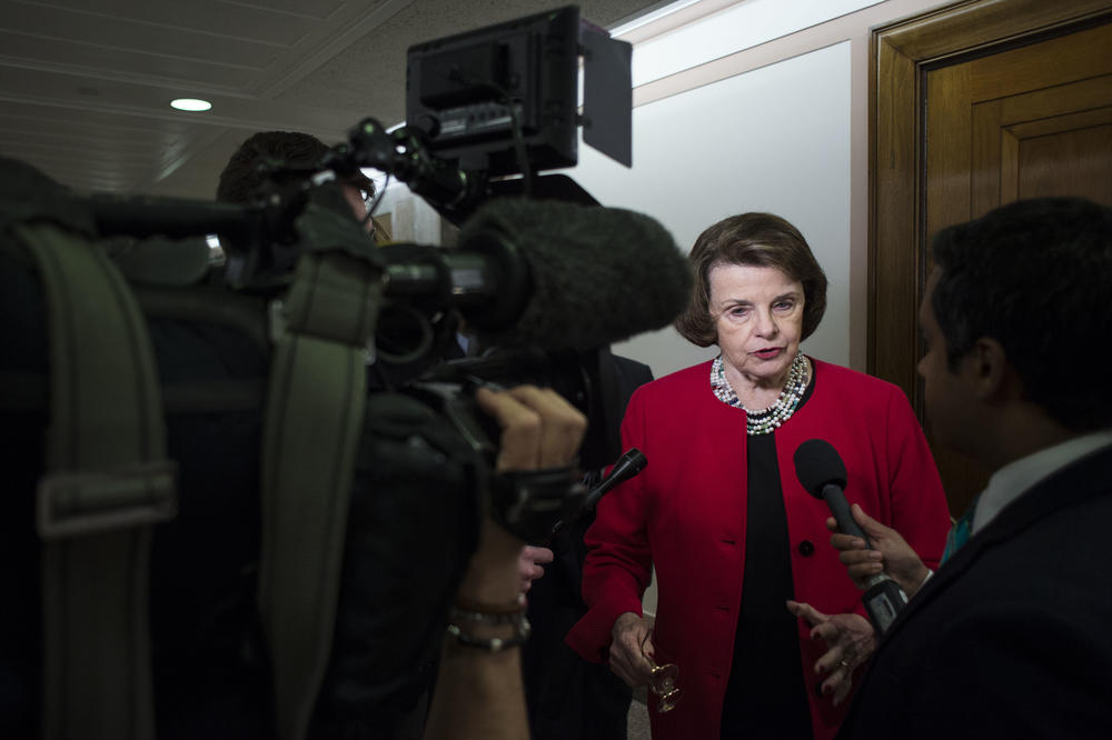 Feinstein speaks with reporters in 2016.