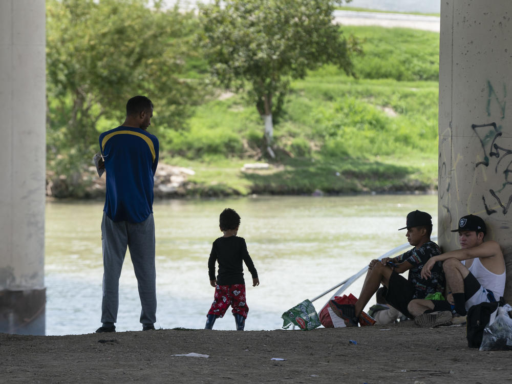 Migrants waiting to be picked up by the U.S. Border Patrol under an international bridge in Eagle Pass, Texas, earlier this month.