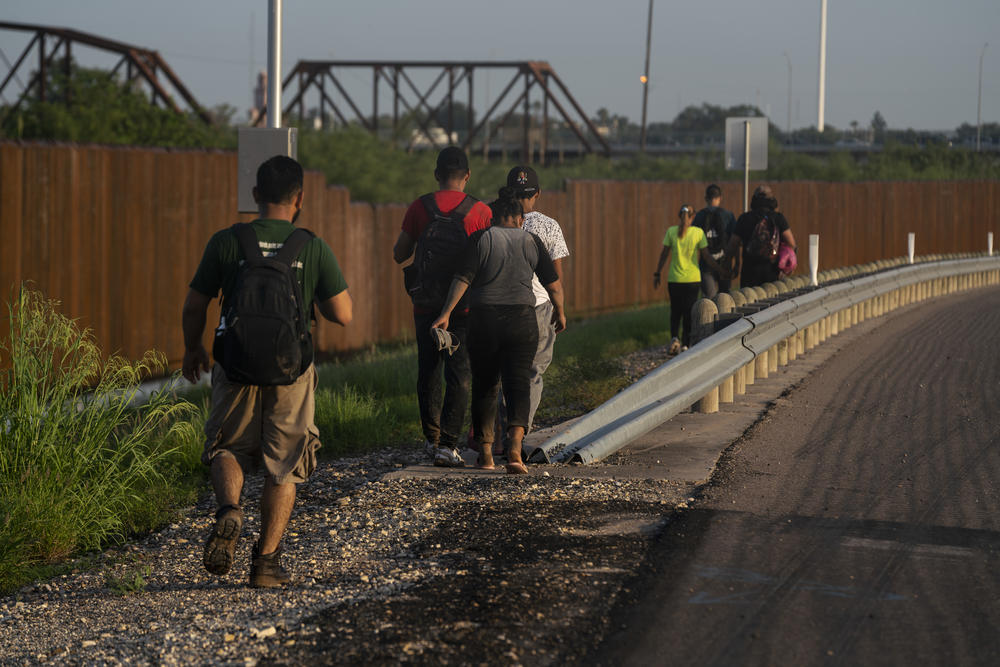 Migrants preparing to turn themselves in to the Border Patrol in Eagle Pass, Texas.