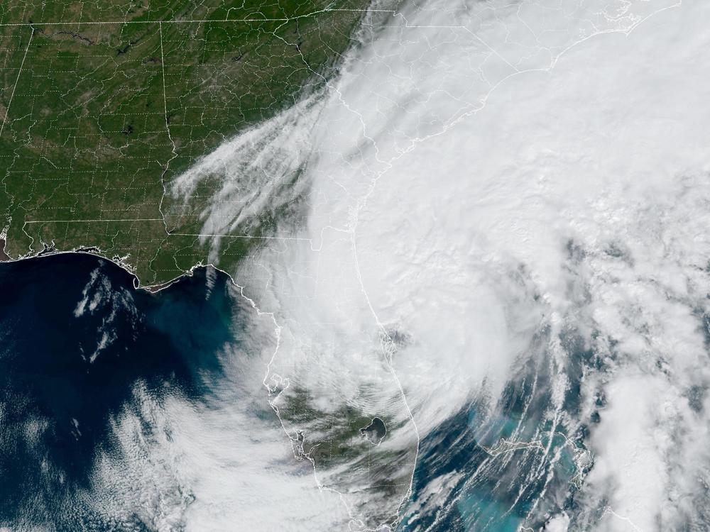Tropical Storm Ian will regain some of the power it lost passing over land as it, returning to hurricane status later Thursday, according to the National Hurricane Center. It's seen here shortly before noon ET.