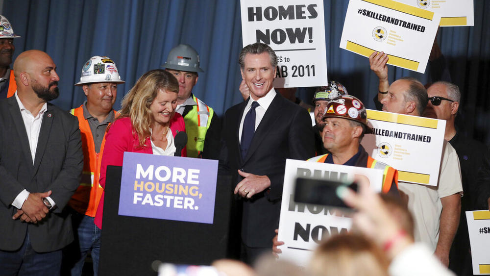 Gov. Gavin Newsom, center, stands with local and state officials Wednesday at 4200 Geary Blvd., an affordable senior housing development in San Francisco.