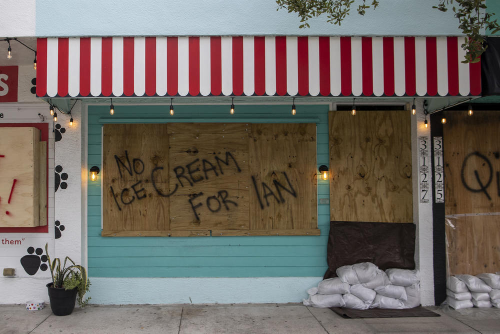 A boarded up business is seen on Sept. 27, 2022, in Gulf Port, Fla., before Hurricane Ian hit the area.