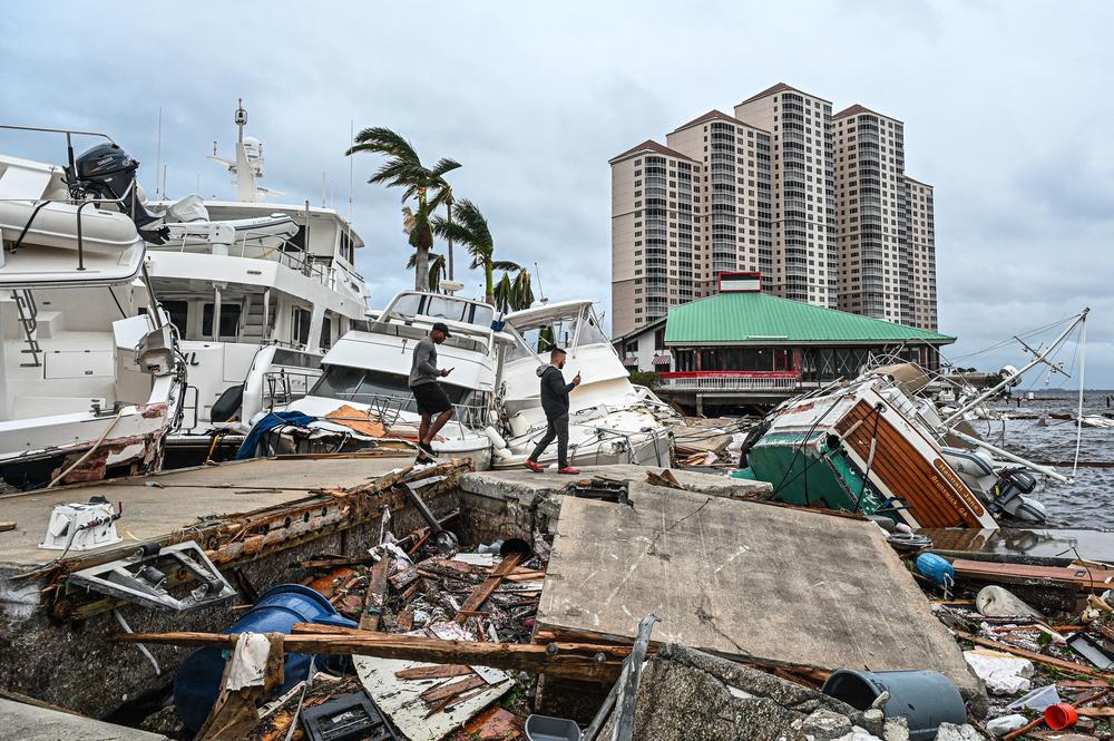 Boats are left stranded on the shore in the aftermath of Hurricane Ian in Fort Myers, Fla., on Sept. 29, 2022.