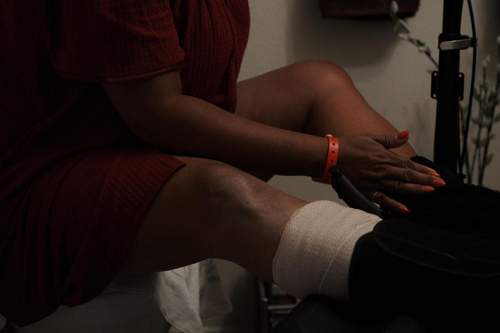 Li'Shey Johnson underwent surgery on her ankle and shoulder in 2018 from injuries she said she endured trying to hide and escape the night of the shooting while working hospitality at Route 91.