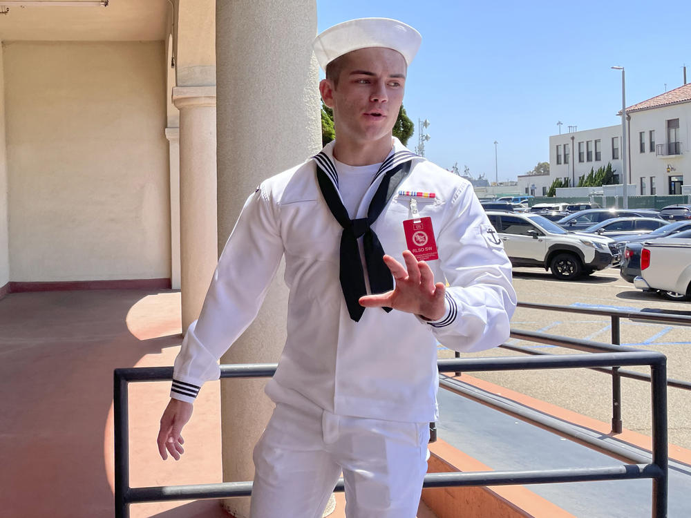 US Navy sailor Ryan Sawyer Mays walks past reporters at Naval Base San Diego before entering a Navy courtroom, Aug. 17, 2022, in San Diego.
