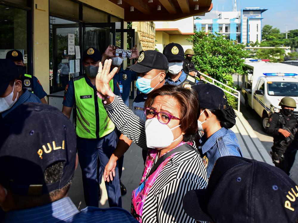 Former Philippine Senator and human rights campaigner Leila de Lima, a high-profile critic of former President Rodrigo Duterte and his deadly drug war, arrives at her hearing on illegal drug charges at the Muntinlupa Trial Court in Manila on Aug. 26.