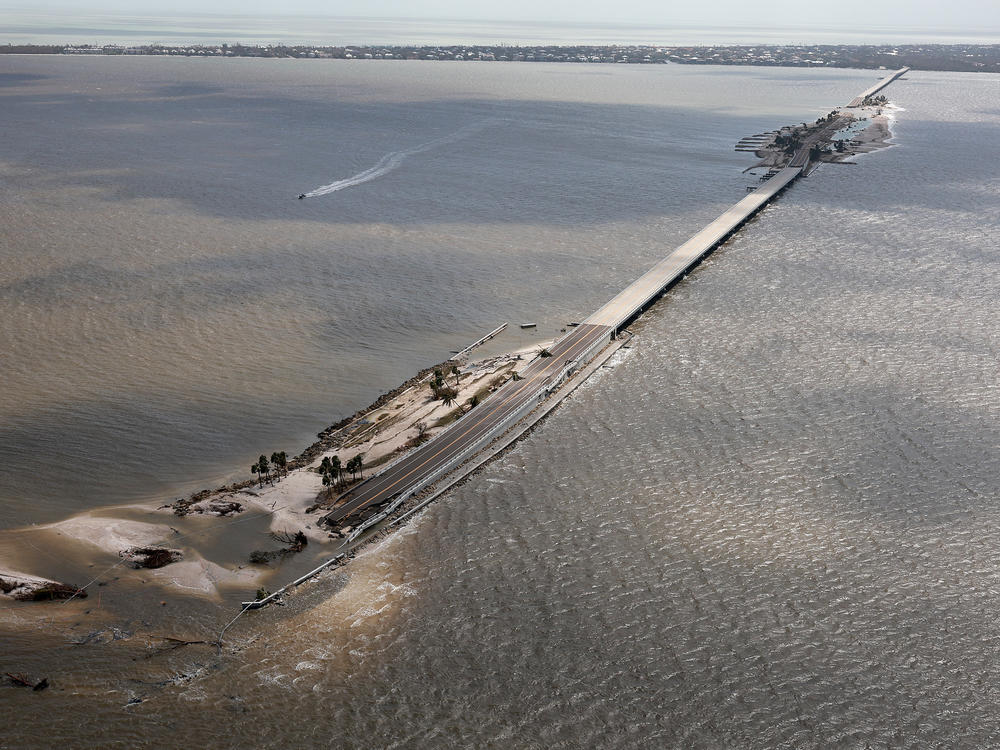 In this aerial photo taken in the aftermath of Hurricane Ian on Thursday, parts of the Sanibel Causeway are washed away along with sections of the bridge.