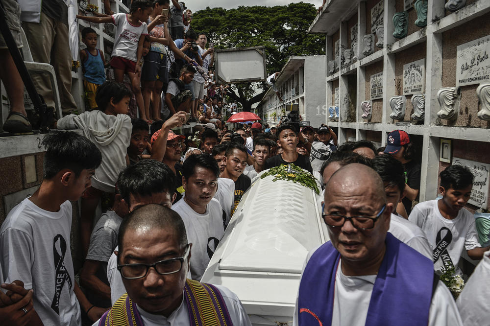 The funeral of 17-year-old Kian Loyd Delos Santos in Caloocan on Aug. 26, 2017. Police say Delos Santos fought back during an anti-drug operation, but witnesses and security footage saw plainclothes police dragged Delos Santos to a dark lot where he was killed. Thousands marched at the funeral, condemning the thousands of extrajudicial killings under President Rodrigo Duterte's war on drugs.