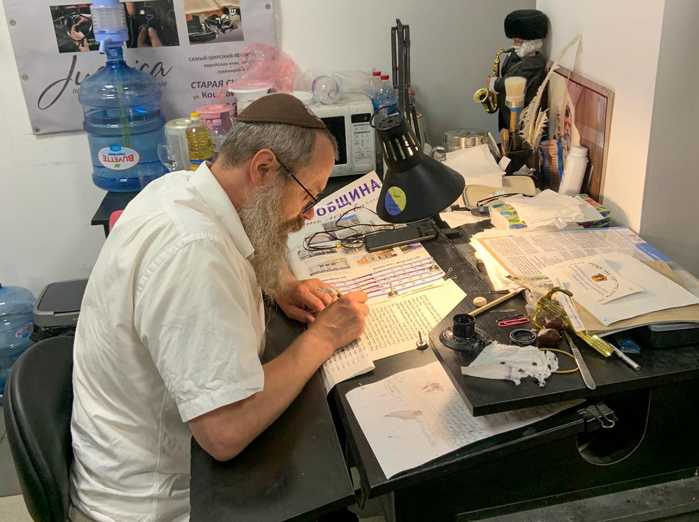 Itskhak Maltsev inscribes a Torah at the Menorah Cultural and Business Center in Dnipro in July.