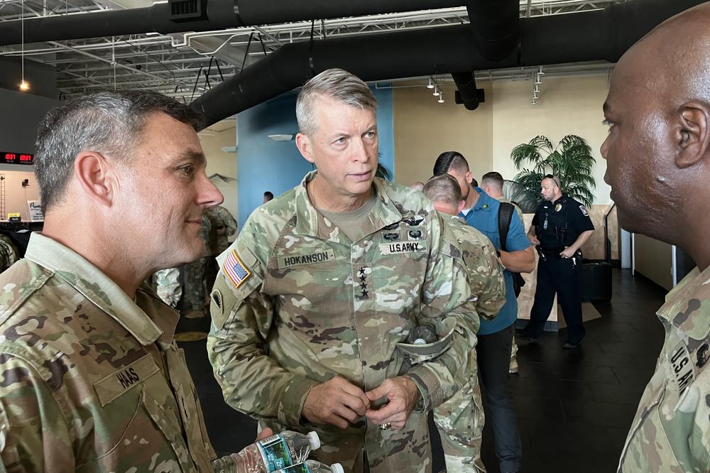 Gen. Daniel Hokanson, chief of the National Guard Bureau (center), is briefed on relief efforts at the Southwest Florida International Airport in Lee County on Saturday. <strong></strong>The National Guard is part of relief and recovery efforts after Hurricane Ian struck the state.