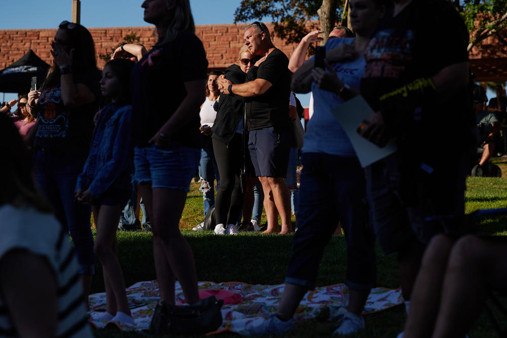 Lori Cammer and Todd Cammer embrace during the Sunrise Remembrance ceremony at Clark County Government Center Amphitheater in Las Vegas on Oct. 1, 2022.