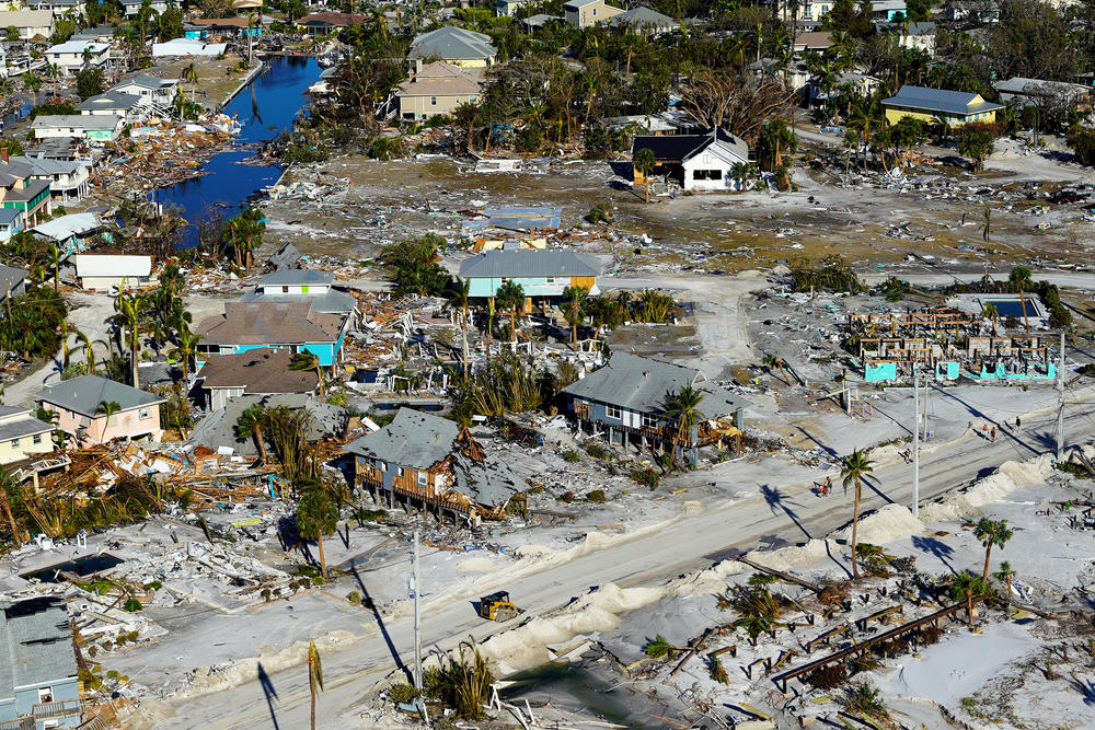Destroyed houses and buildings are visible in Fort Myers Beach, Fla., on Friday.