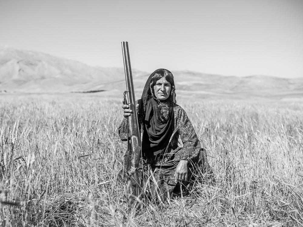 This gun held by 35-year-old Fatima was a wedding gift from her husband. Families of the nomadic Bakhtiari tribes of Iran may own several weapons, used to defend themselves and their livestock against thieves and wild animals. Fatima is known for her shooting and riding skills.