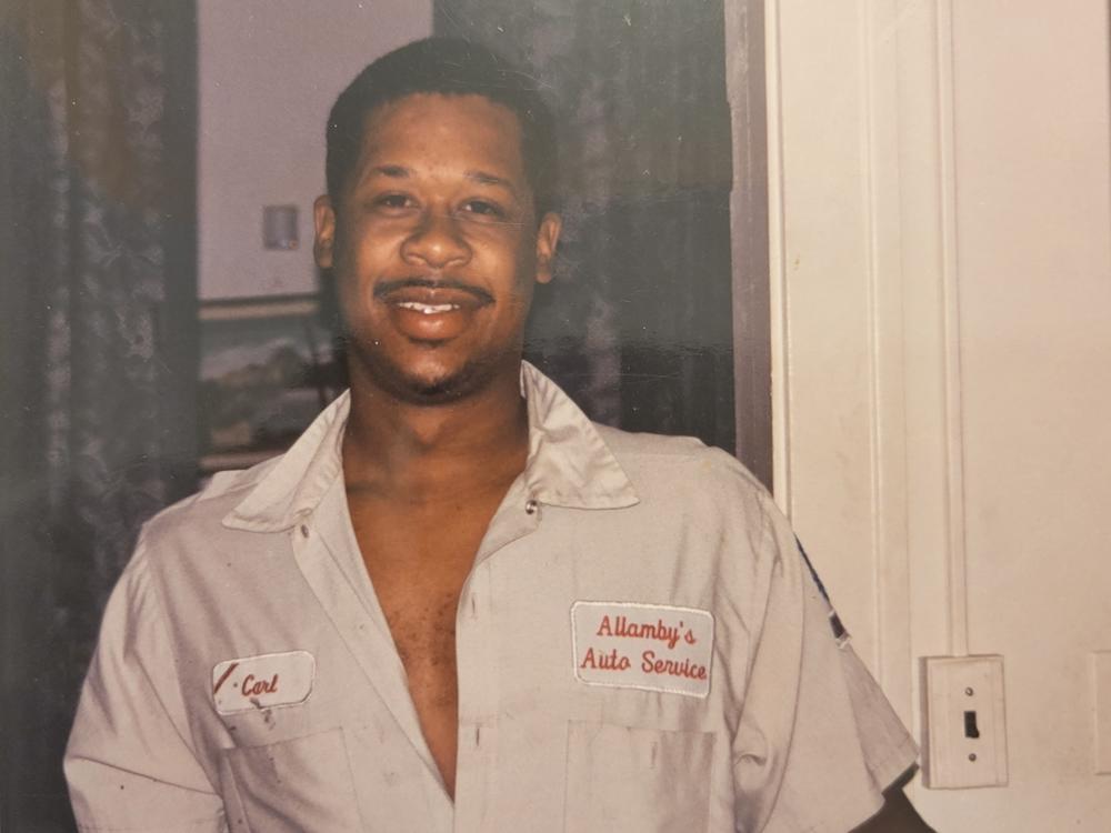 A much younger Carl Allamby, pictured in his auto repair shop in Cleveland, Ohio.