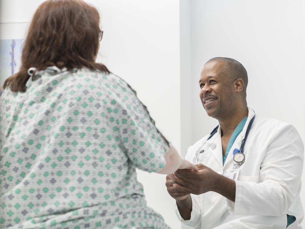 Carl Allamby with a patient at the Cleveland Clinic. 