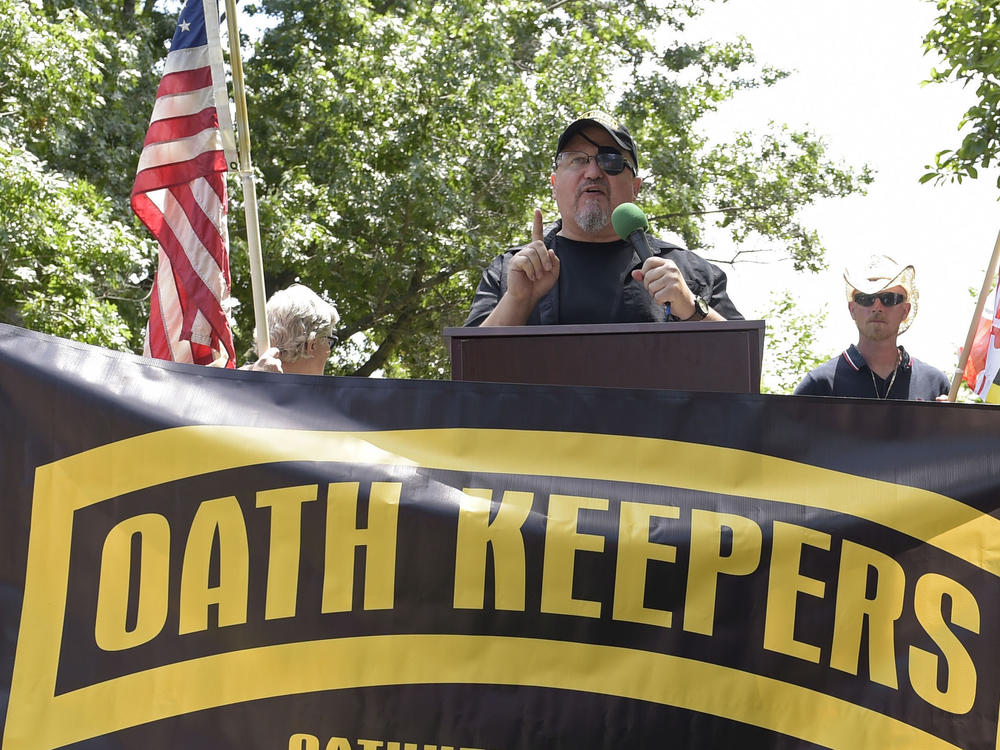 Stewart Rhodes, founder of the Oath Keepers, center, speaks during a rally outside the White House in Washington on June 25, 2017.