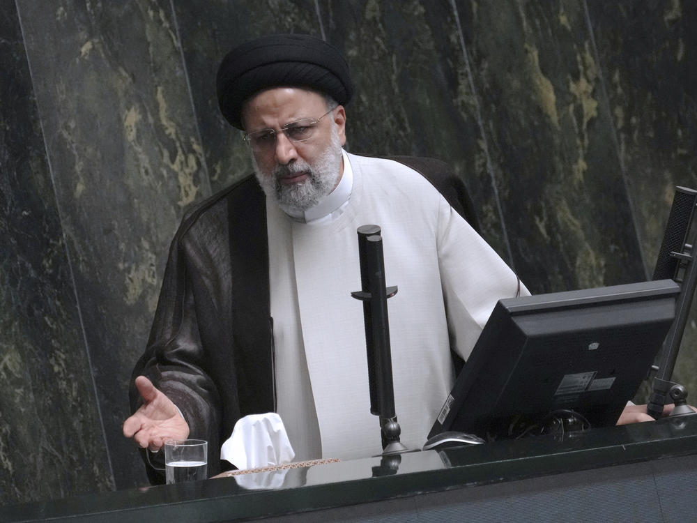 Iranian President Ebrahim Raisi addresses the parliament in a vote of confidence session for his proposed labor minister in Tehran, Iran, Tuesday, Oct. 4, 2022.