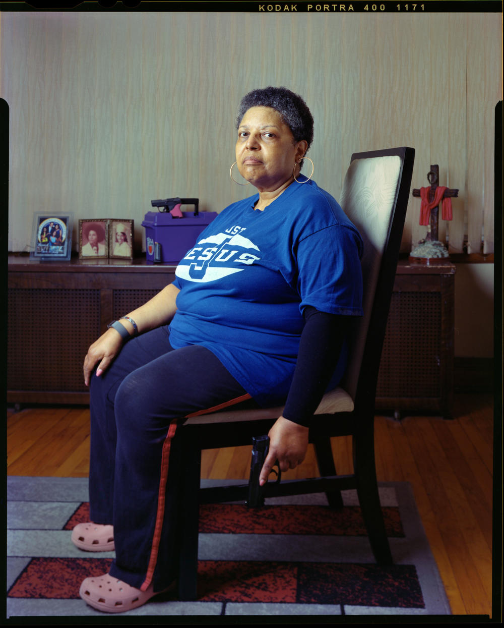 Angela Ross Williams, 67, in her living room on Wednesday, July 13, 2022, in Chicago. Williams says she needs her firearm because there is a lot of crime in Chicago, which stems from a lack of housing, food, jobs and access to mental health facilities.