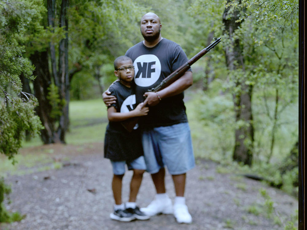 Aaron Banks, 38, and his son Aaron Banks, Jr., 8, embrace at a local park on Saturday, May 22, 2021, in Cedar Park, Texas. 