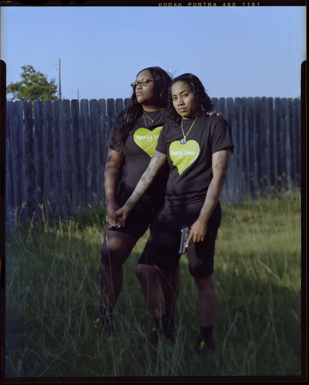 Alisa Coleman, 25, left, embraces Sharise Campbell, 26, after their date at a local gun range. 