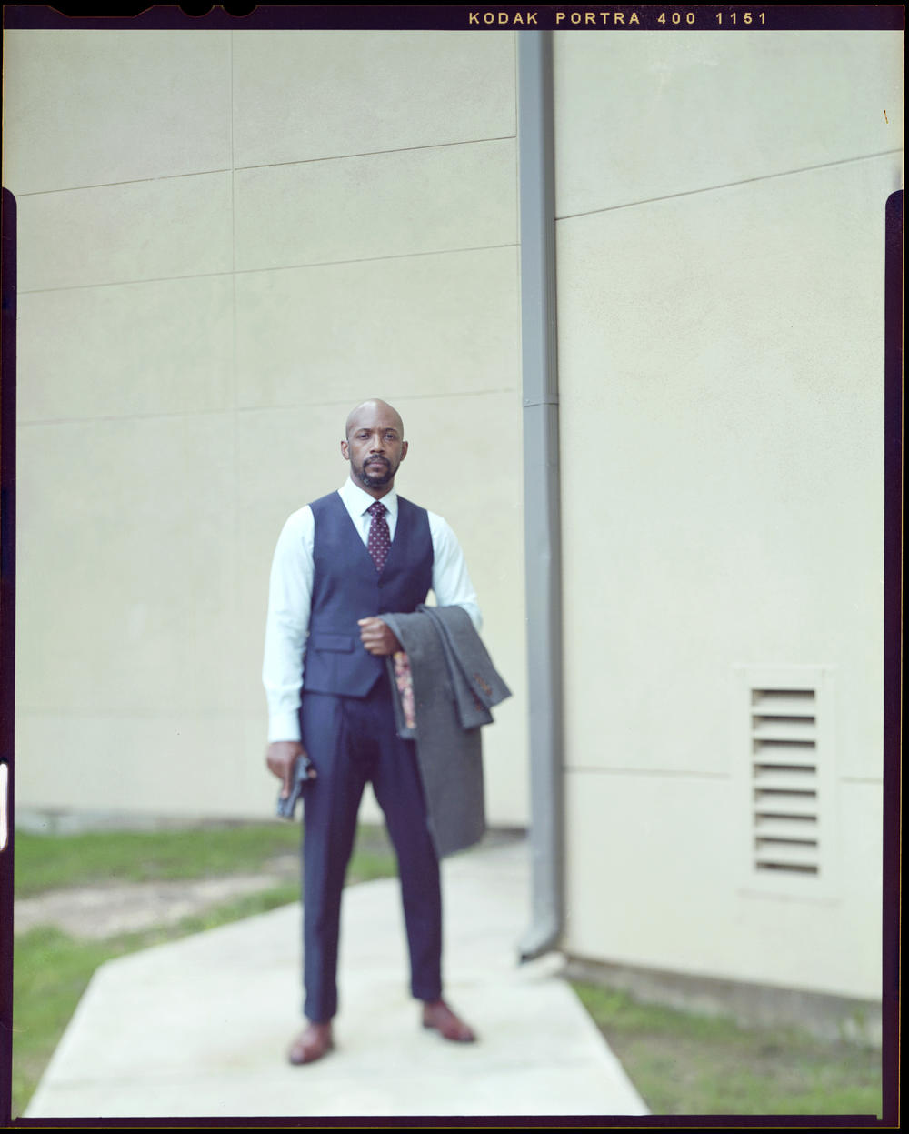Brandon Antone, 37, stands outside of his apartment complex with his firearm on Wednesday, May 26, 2021. Antone started a Facebook group with nearly 2,000 members in the Austin area with the goal of creating a safe space for African Americans to talk about firearms. 