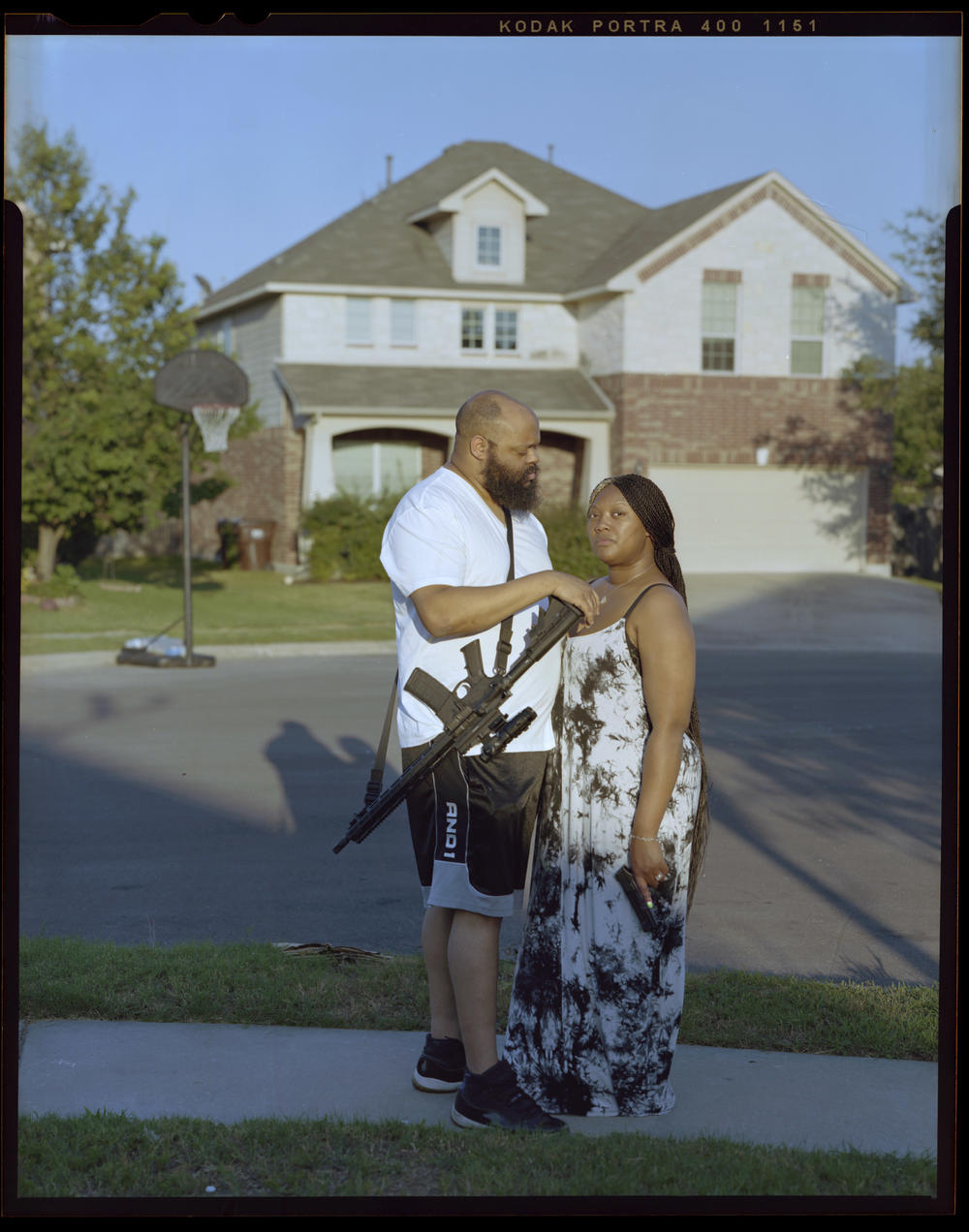 Justin Barlow, 34, left, gazes at his wife, Cha'von Barlow, 33, outside their home on Saturday, June 18, 2021, in Round Rock, Texas. 