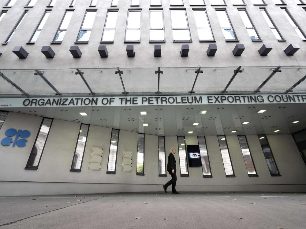 A man walks past OPEC headquarters in Vienna on Tuesday on the eve of the 45th meeting of the Joint Ministerial Monitoring Committee and the 33rd OPEC and non-OPEC Ministerial Meeting. The in-person meeting of OPEC members led by Saudi Arabia and allied members headed by Russia will be the first in the Austrian capital since the spring of 2020.