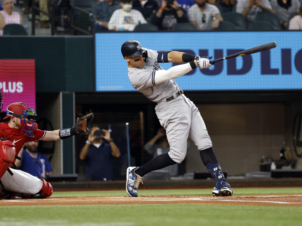 Aaron Judge #99 of the New York Yankees hits his 62nd home run of the season against the Texas Rangers during the first inning in game two of a double header at Globe Life Field on Tuesday in Arlington, Texas.