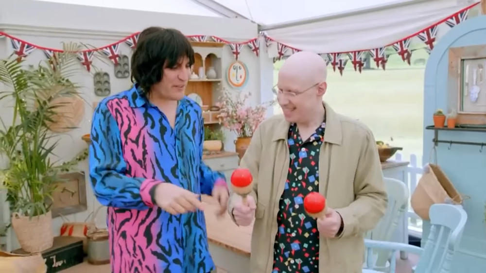 <em>The Great British Bake Off</em> host Matt Lucas playing the maracas.