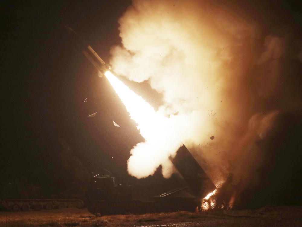 In this photo provided by South Korea Defense Ministry, an Army missile is fired during a joint military drill between U.S. and South Korea at an undisclosed location in South Korea, Wednesday, Oct. 5, 2022.