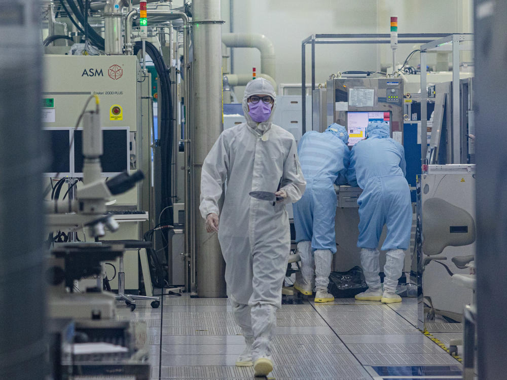 A student conducts research inside the clean room of Taiwan Semiconductor Research Institution during a press semiconductor tour at Hsinchu Science Park on Sept. 16 in Hsinchu, Taiwan.
