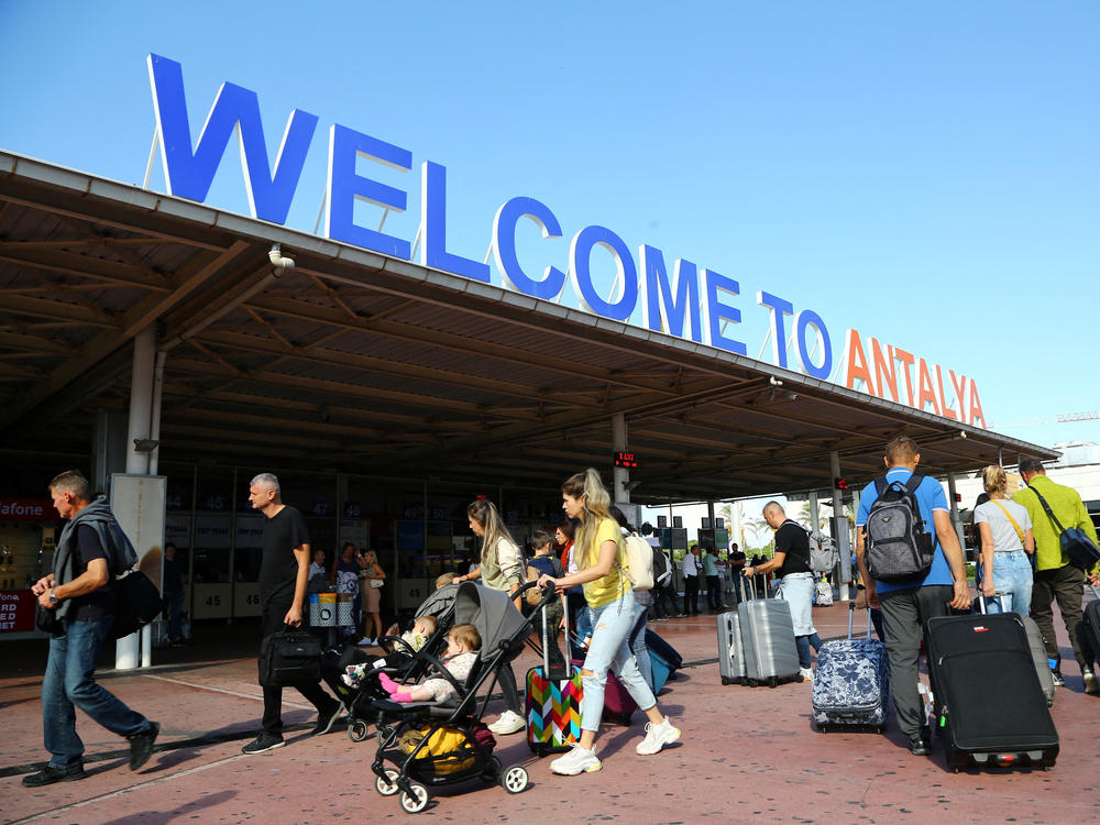 Tourists, coming mainly from Russia, at the arrival terminal at Antalya International Airport in the Mediterranean resort city of Antalya on Sept. 22, the day after Russian President Vladimir Putin announced a draft for Ukraine.