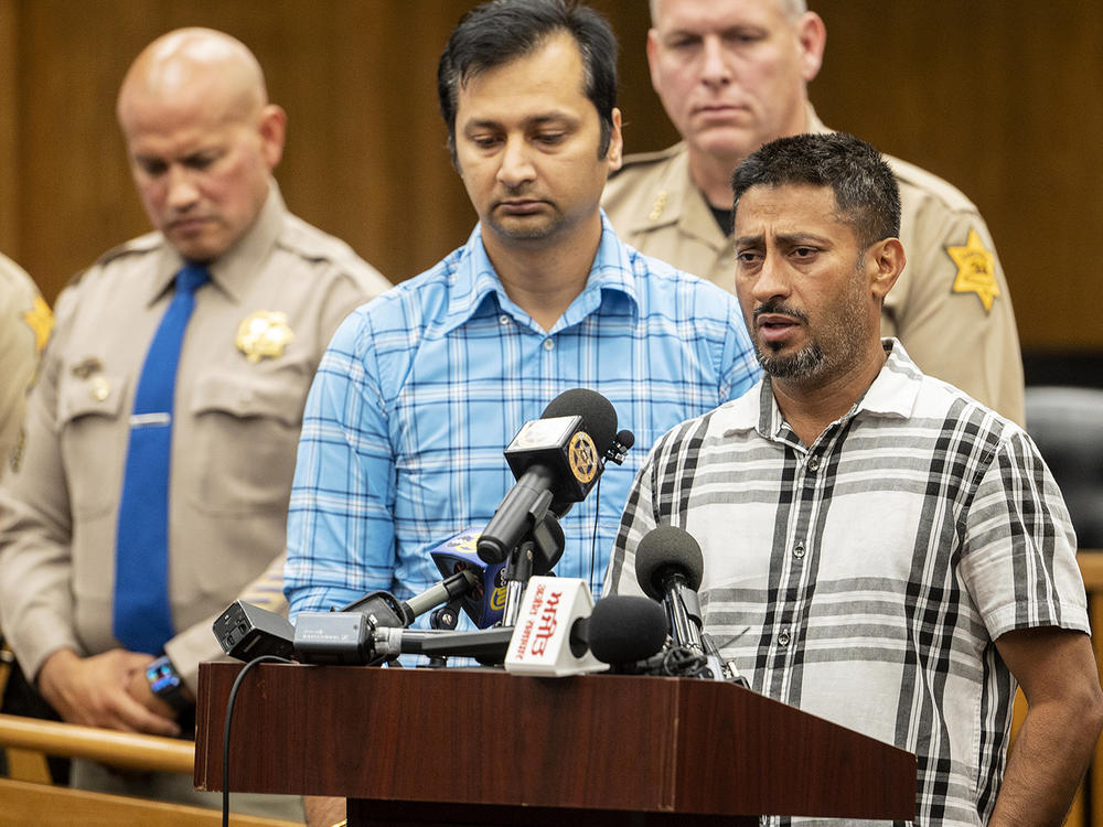 Sukhdeep Singh, right, and Balwinder Saini, middle, speak about the kidnapping of their family members, 8-month-old Aroohi Dheri, her mother Jasleen Kaur, her father Jasdeep Singh, and her uncle Amandeep Singh at a news conference in Merced, Calif., on Wednesday, Oct. 5, 2022.