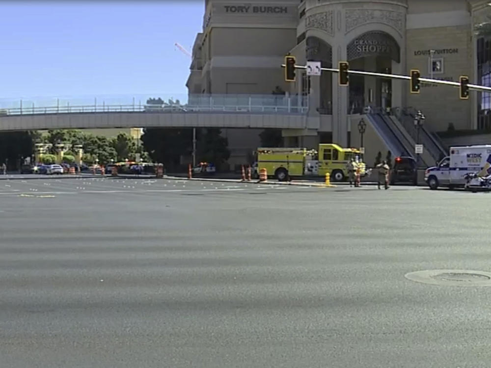 Emergency personnel respond the scene of a stabbing along the Las Vegas Strip on Thursday, Oct. 6, 2022. Police say one person has been fatally stabbed and at least five others wounded. A suspect is in custody.