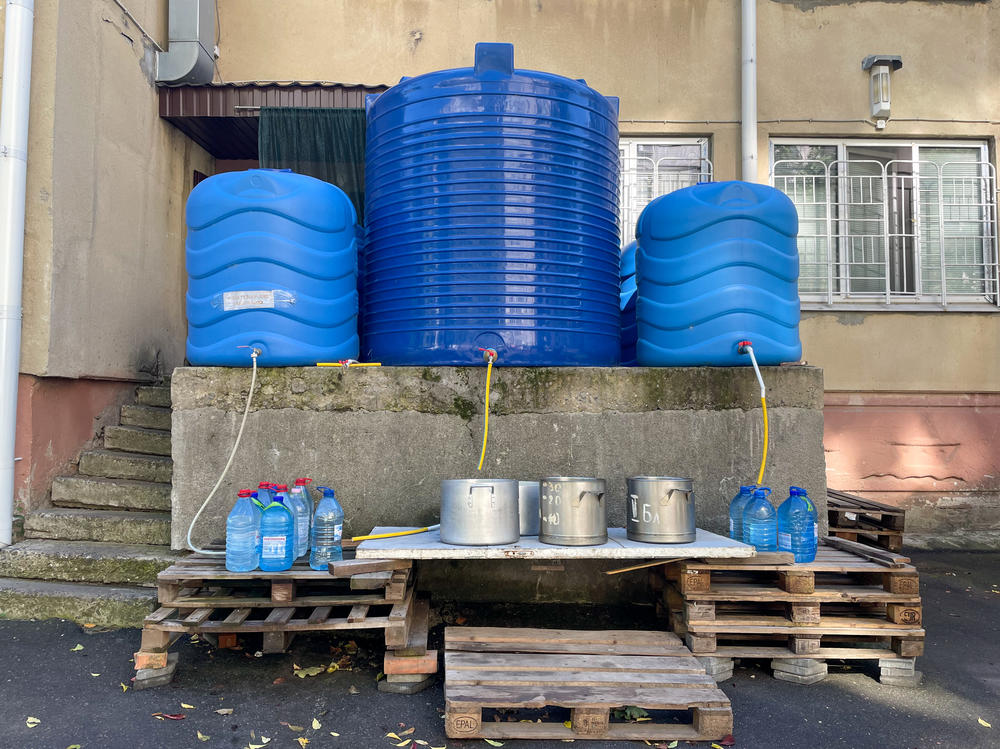 Water tanks contain clean water delivered by truck at a Mykolaiv kindergarten that now houses people who fled the occupied Kherson region.