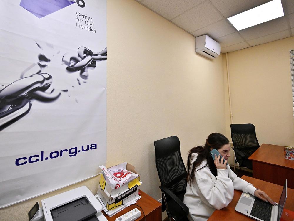 An employee of Ukraine's Center for Civil Liberties works in the office in Kyiv on Friday.