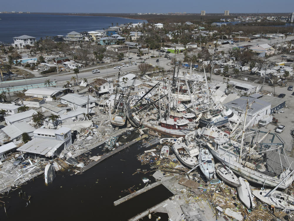 In this photo shot with a drone, shrimp boats lie grounded atop what was a mobile home park, following the passage of Hurricane Ian, on San Carlos Island in Fort Myers Beach, Fla., Friday, Oct. 7, 2022.