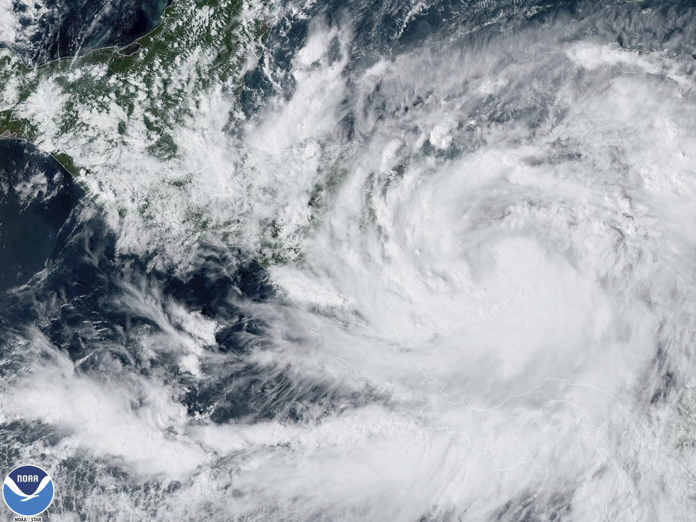 A satellite image shows Tropical Storm Julia, bottom right, at 4 p.m. EDT. Julia is gaining strength heading westward in the southern Caribbean.