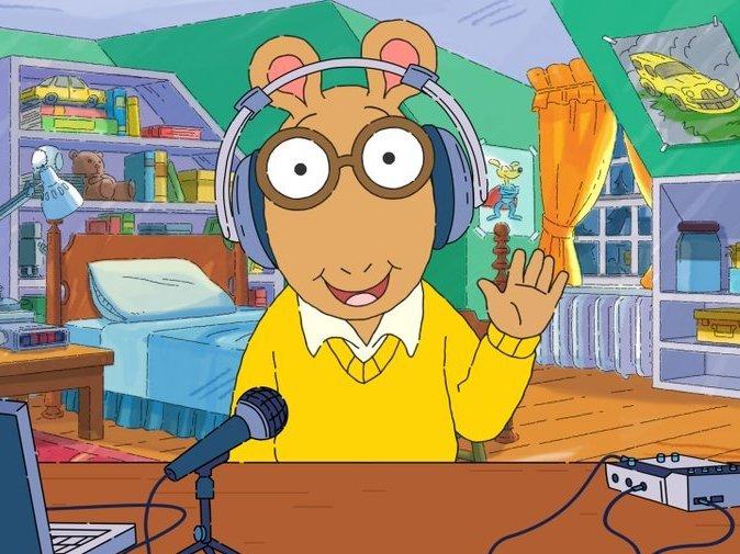 In a digital short previewing the podcast, Arthur shows his audio equipment and once again, his headphones are not on his actual ears.