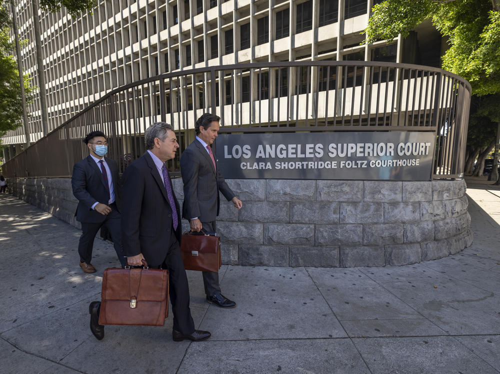 Mark Werksman (C) and Alan Jackson (R), attorneys for Harvey Weinstein, walk from Clara Shortridge Foltz Criminal Justice Center.