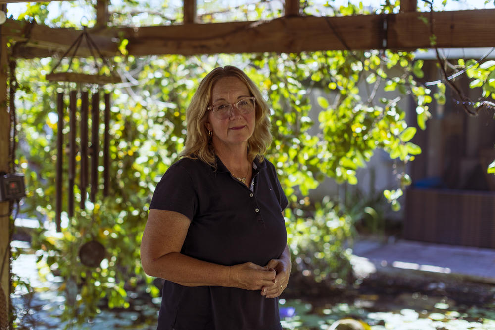 Artist Megan Kissinger poses for a photograph at her home in Fort Myers.