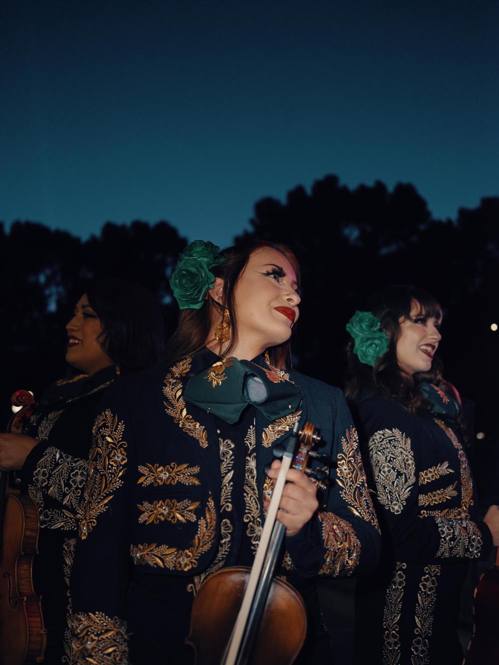 Three members of the Mariachi Divas group pose for a photo at the MARIACHI USA festival in June.