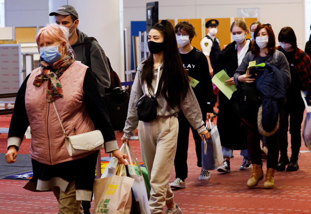 Ukrainian refugees arrive at Haneda airport in Tokyo on April 5.