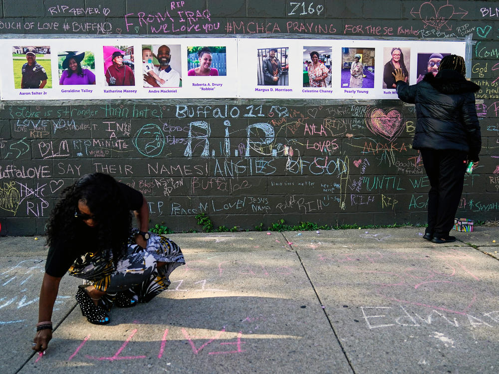 The gunman charged with killing 10 Black people and injuring three other individuals in the mass shooting at a Buffalo, N.Y., supermarket in May will not be pursuing a psychiatric defense in his state case, officials say. Here, people pay their respects at a makeshift memorial near the scene of the mass shooting a few days after it occurred.